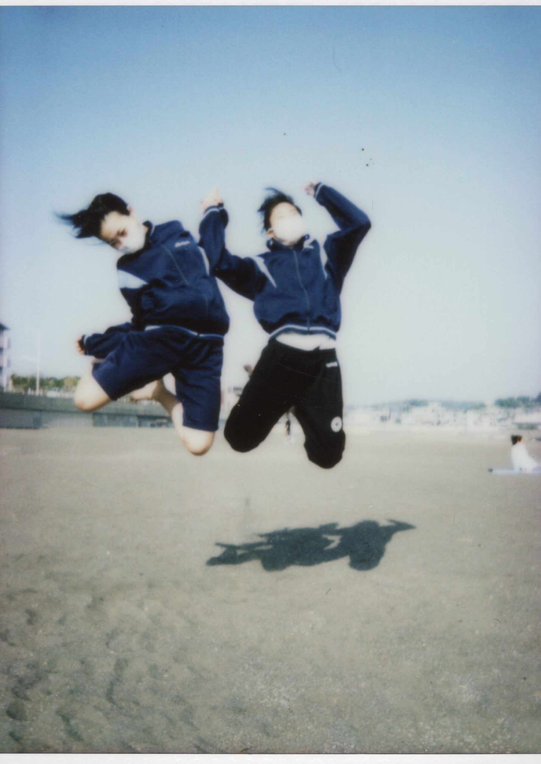 Instax picture of two girls at Kamakura beach, Japan. Photo by Niek de Greef